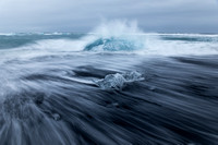 wave wash on a black sand beach