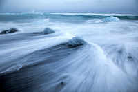 wave wash on a black sand beach